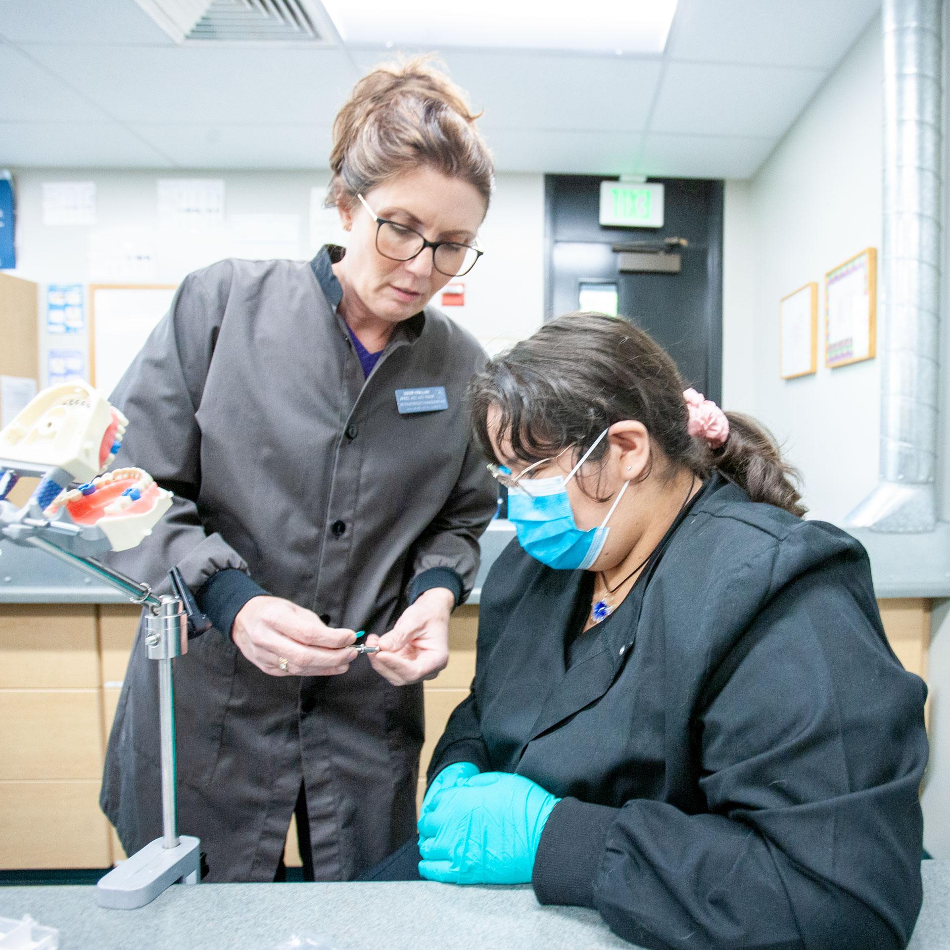 Dental Assisting student and teacher